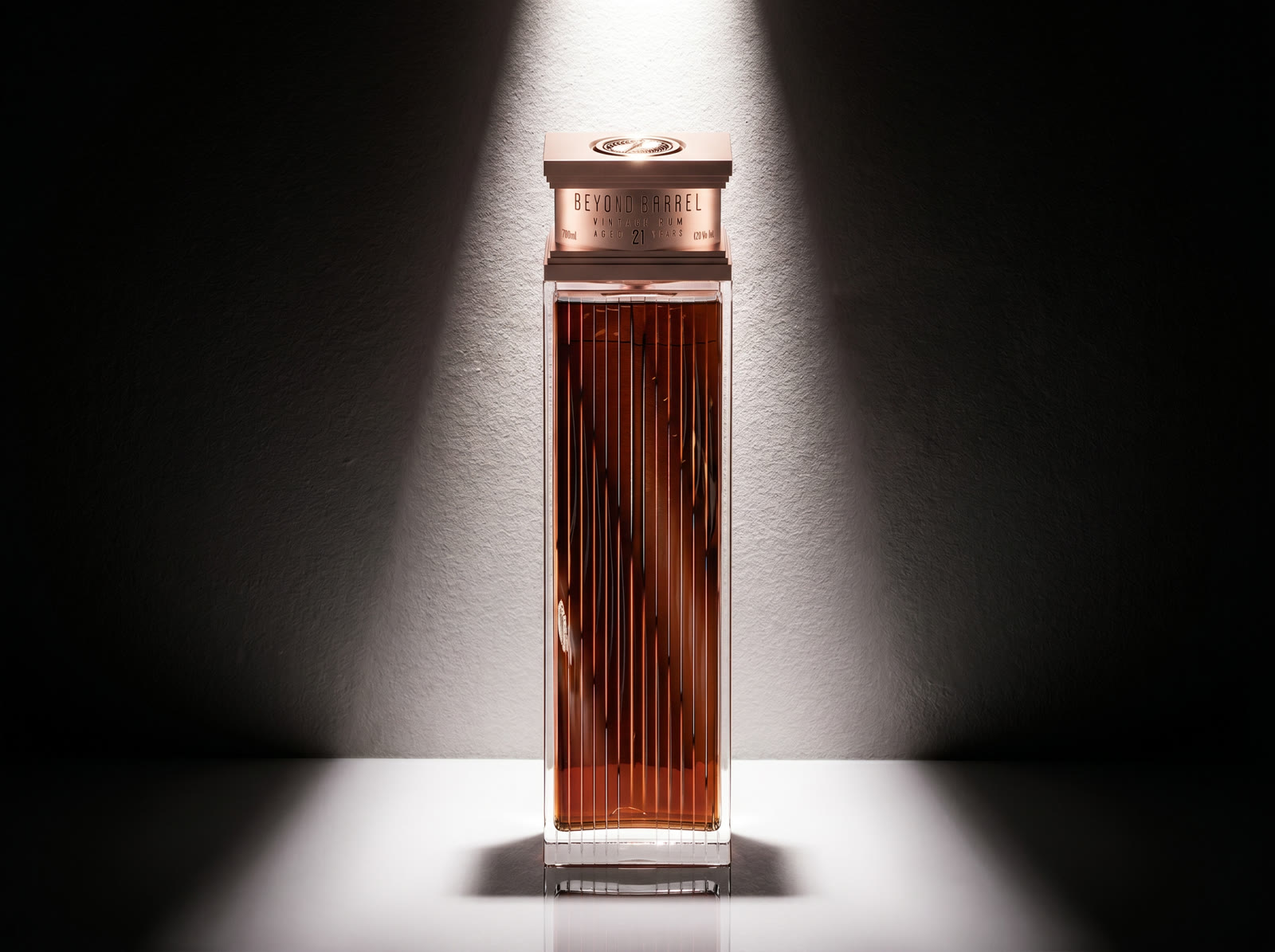 Beyond Barrel bottle standing under a single spotlight
